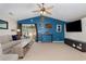 Comfortable living room with vaulted ceilings, ceiling fan, and blue accent wall at 3012 Sabal Ct., Murrells Inlet, SC 29576