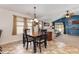 Bright dining area open to the living room, featuring large windows and natural light at 3012 Sabal Ct., Murrells Inlet, SC 29576