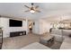 Spacious living room with a ceiling fan and a view into the kitchen and hallway at 3012 Sabal Ct., Murrells Inlet, SC 29576
