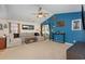 Bright living room with vaulted ceiling, ceiling fan, and sliding glass door leading to an outdoor space at 3012 Sabal Ct., Murrells Inlet, SC 29576