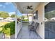 Cozy covered porch with comfortable seating and a ceiling fan, perfect for relaxing outdoors at 3012 Sabal Ct., Murrells Inlet, SC 29576