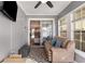 Bright sunroom with slider door and lots of natural light and view to living room at 3012 Sabal Ct., Murrells Inlet, SC 29576