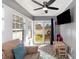 Sunroom with gray shiplap walls, ceiling fan, and sliding door to the backyard at 3012 Sabal Ct., Murrells Inlet, SC 29576