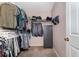 Walk-in closet with organized shelving and hanging space, including a gun safe for secure storage at 3012 Sabal Ct., Murrells Inlet, SC 29576