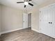 A well-lit bedroom featuring wood-look floors and a closet with double doors at 3415 B And S Rd., Loris, SC 29569
