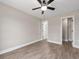 An open bedroom has wood-look floors, an open closet, and natural light from a doorway at 3415 B And S Rd., Loris, SC 29569