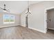 Living room with a vaulted ceiling, ceiling fan, and large window at 3415 B And S Rd., Loris, SC 29569