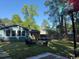 Enjoy the outdoors in this backyard with patio furniture, space for games, and wooded surroundings at 342 Red Fox Rd., Myrtle Beach, SC 29579