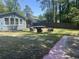 Backyard featuring a sitting area and a mix of lawn and paving stone at 342 Red Fox Rd., Myrtle Beach, SC 29579