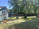 Backyard with green space, trees, and a seating area for relaxing outdoors at 342 Red Fox Rd., Myrtle Beach, SC 29579
