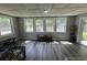 Versatile bonus room with multiple windows and modern floors for customizable space at 342 Red Fox Rd., Myrtle Beach, SC 29579