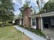 Charming brick home with manicured landscaping, paved walkway, and inviting curb appeal at 342 Red Fox Rd., Myrtle Beach, SC 29579