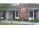 Close-up of the front of the house, showing the brick accents and manicured flower beds at 342 Red Fox Rd., Myrtle Beach, SC 29579