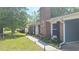 Inviting exterior with brick chimney, beautiful landscaping, and a well-maintained lawn at 342 Red Fox Rd., Myrtle Beach, SC 29579