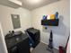 Convenient laundry room with modern washer and dryer, shelving, and gray painted flooring at 342 Red Fox Rd., Myrtle Beach, SC 29579