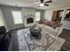 Spacious living room with a fireplace, large rug, and comfortable sofa, perfect for relaxing and entertaining at 342 Red Fox Rd., Myrtle Beach, SC 29579