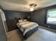 Comfortable main bedroom with ample storage provided by a built-in dresser and a soothing dark color scheme at 342 Red Fox Rd., Myrtle Beach, SC 29579