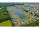 Extensive aerial view of a neighborhood with houses surrounding dual interconnected lakes at 356 Whipple Run Loop, Myrtle Beach, SC 29588