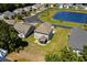 Aerial view of a well-maintained home next to a pond in a residential neighborhood at 356 Whipple Run Loop, Myrtle Beach, SC 29588