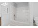 Bright bathroom featuring a white tiled shower/tub combination with built-in shelves and chrome showerhead at 356 Whipple Run Loop, Myrtle Beach, SC 29588