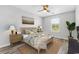 Cozy bedroom with a ceiling fan, a bed with decorative pillows, and wood nightstands at 356 Whipple Run Loop, Myrtle Beach, SC 29588
