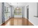Bright dining area with hardwood floors, large windows, and modern lighting at 356 Whipple Run Loop, Myrtle Beach, SC 29588