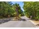 Scenic community entrance with lush greenery and stone pillars at 356 Whipple Run Loop, Myrtle Beach, SC 29588