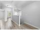 Open hallway features wood-look flooring, neutral paint, and natural light from nearby windows at 356 Whipple Run Loop, Myrtle Beach, SC 29588