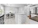 Kitchen with island and dining area features modern lighting and tile flooring at 356 Whipple Run Loop, Myrtle Beach, SC 29588