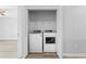 A laundry closet with white washer and dryer, wire shelving, and gray walls at 356 Whipple Run Loop, Myrtle Beach, SC 29588
