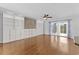 Bright and airy living room with hardwood floors, built-in shelving, and sliding glass doors at 356 Whipple Run Loop, Myrtle Beach, SC 29588