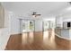 Open-concept living space with hardwood floors, access to a patio, and a view of the kitchen at 356 Whipple Run Loop, Myrtle Beach, SC 29588
