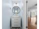 Stylish powder room features a modern vanity, round mirror, and decorative flooring at 356 Whipple Run Loop, Myrtle Beach, SC 29588