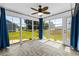 Bright sunroom with large windows showcasing the backyard view, completed with stylish flooring and decor at 356 Whipple Run Loop, Myrtle Beach, SC 29588