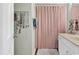 Bathroom featuring a white vanity with a solid surface top and a shower with a pink curtain at 4006 Fairway Lakes Dr. # 4006, Myrtle Beach, SC 29577