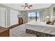 Bright bedroom boasts a ceiling fan, closet, and large sliding glass doors to deck at 4006 Fairway Lakes Dr. # 4006, Myrtle Beach, SC 29577