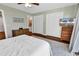 Bright bedroom boasts a ceiling fan, closet, and dressers for storage at 4006 Fairway Lakes Dr. # 4006, Myrtle Beach, SC 29577