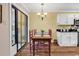 Cozy eat-in kitchen featuring a sliding glass door and breakfast table at 4006 Fairway Lakes Dr. # 4006, Myrtle Beach, SC 29577