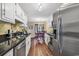 Kitchen featuring stainless appliances and sleek countertops with views of the dining area at 4006 Fairway Lakes Dr. # 4006, Myrtle Beach, SC 29577
