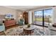 Well-lit living room with hardwood floors, plush seating, and a serene view of the outdoor environment at 4006 Fairway Lakes Dr. # 4006, Myrtle Beach, SC 29577