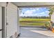 A covered patio with a view of the green space and pond at 4006 Fairway Lakes Dr. # 4006, Myrtle Beach, SC 29577