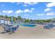 Community pool with lounge chairs, tables and umbrellas at 4006 Fairway Lakes Dr. # 4006, Myrtle Beach, SC 29577