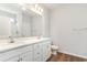 Well-lit bathroom with double vanity and white cabinets at 419 Lifestyle Court, Surfside Beach, SC 29575