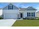 Charming single-Gathering home featuring a two-car garage and manicured lawn at 419 Lifestyle Court, Surfside Beach, SC 29575