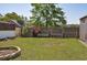 Fenced backyard with a brick fire pit and space for gardening, adding outdoor recreation at 4196 E Highway 319, Conway, SC 29526