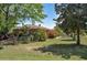 Well-kept backyard with mature trees and landscaping, creating a peaceful outdoor space to relax and enjoy at 4196 E Highway 319, Conway, SC 29526