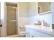 Bright bathroom with white tile, glass shower, and updated fixtures at 4196 E Highway 319, Conway, SC 29526