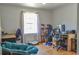 Bright bedroom with natural light, wood floors, and functional desk and seating areas at 4196 E Highway 319, Conway, SC 29526