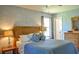 Serene bedroom with textured walls, wood furnishings, and soft lighting at 4196 E Highway 319, Conway, SC 29526