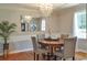 Elegant dining room featuring a wooden table, upholstered chairs, and a modern chandelier at 4196 E Highway 319, Conway, SC 29526